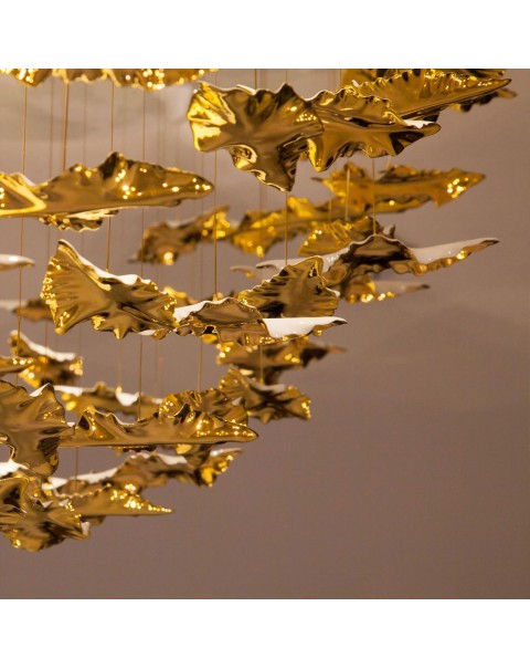 Chandelier with golden branches and jade leaves