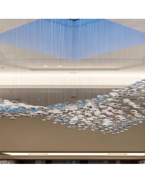 Artistic chandelier hanging in the air in the mall lobby